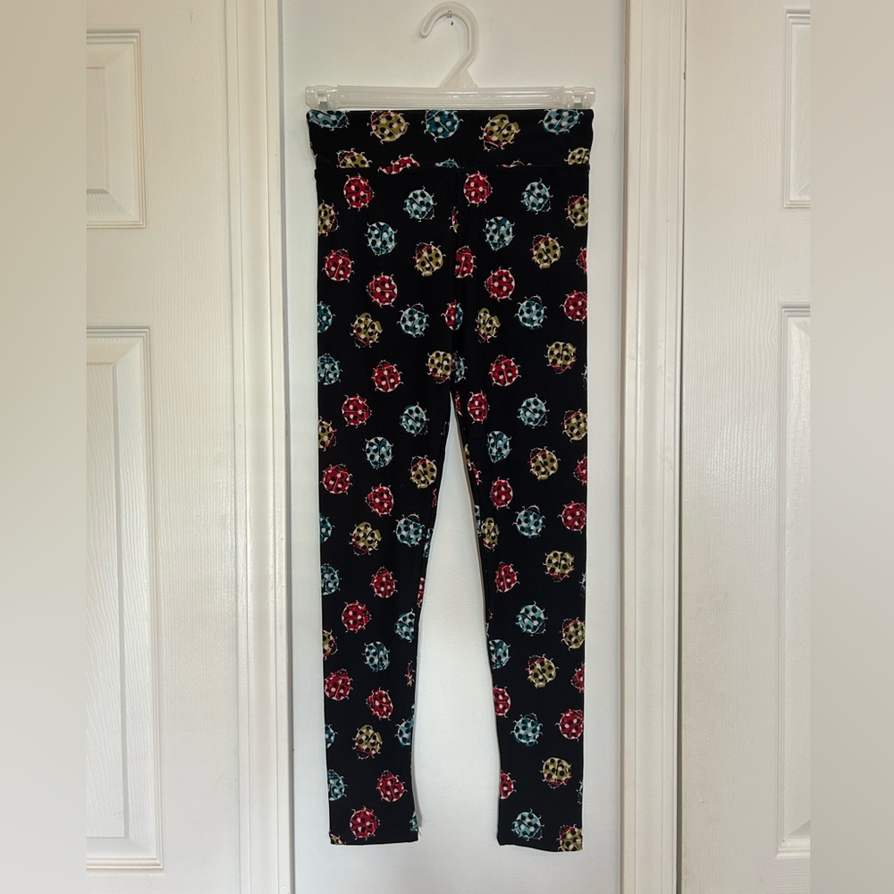 Black Leggings with Red, Blue, and Green Ladybugs